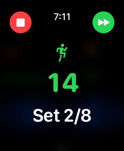 Apple Watch Tabata timer in a work phase, shown in green with a runner symbol, set 2 of 8